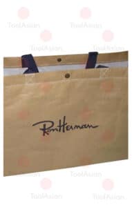 Shopping bag made from kraft paper laminated fabric